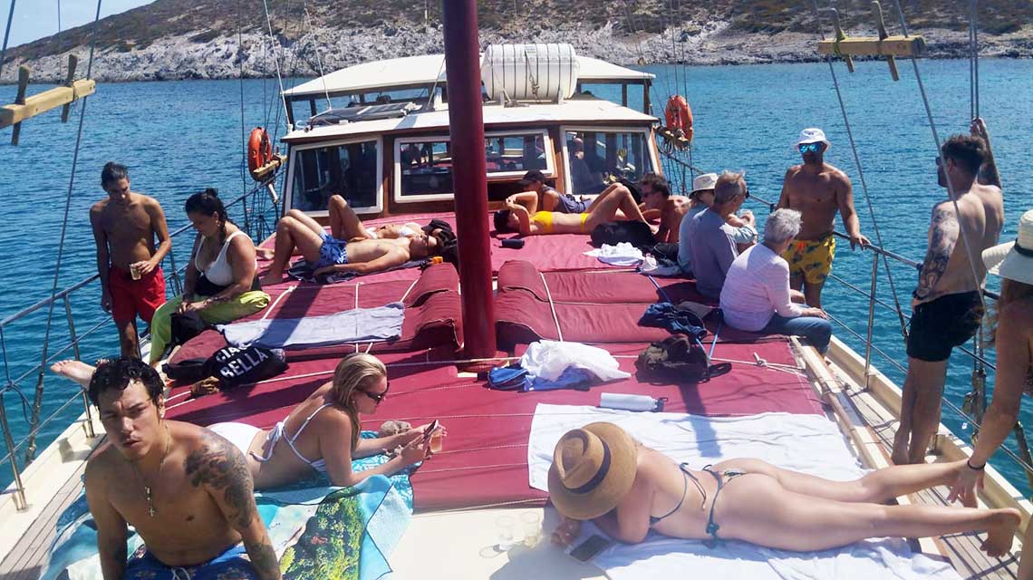 Sunbath at the boat cruise in Paros